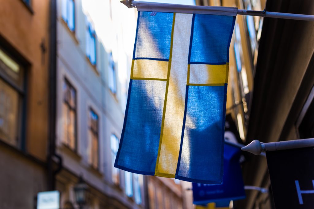 blue and yellow flag on brown wall